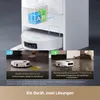 A robot vacuum cleaner with two cleaning solution compartments, shown in two different cleaning scenarios. Produktbild-Vorschau