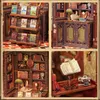 A collage of four images showing different views and details of a DIY book nook kit, designed to look like a miniature bookstore. Produktbild-Vorschau