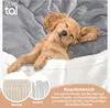 A cute puppy sleeping on a soft blanket. Náhled obrázku produktu