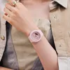 A close-up shot of a person's wrist wearing a pink Casio G-Shock watch. Produktbild-Vorschau