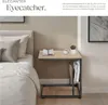 A bedside table next to a bed in a bedroom. Produktbild-Vorschau