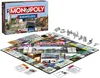 A Monopoly board game set, including the box, board, and game pieces, displayed on a white background. Produktbild-Vorschau