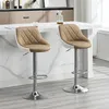 Two bar stools are shown in a modern kitchen or dining area, placed at a counter. Náhľad obrázku produktu