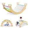 A collage of images showing a wooden climbing arch with a cushion, used by children in different configurations. Produktbild-Vorschau