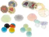 A collection of colorful toy balls, octagonal tiles with cartoon images, and plastic track pieces are arranged on a white background. Náhled obrázku produktu