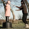 A man practicing martial arts with a BOB dummy outdoors. Podgląd zdjęcia produktu