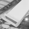 A close-up of a white plastic cable duct with an open end, against a blurred industrial background. Produktbild-Vorschau