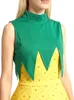 Close-up of a woman wearing a green top with a yellow patterned dress underneath, resembling a pineapple costume. Anteprima dell’immagine prodotto