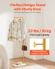 A gold clothes hanger stand with two shirts and a handbag hanging on it, placed on a white marble base. Anteprima dell’immagine prodotto