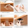 A four-panel instructional image showing how to install a hook rack under a cabinet shelf. Produktbild-Vorschau