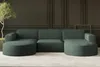 A modern, deep green sectional sofa with rounded chaise lounges is shown in a minimalist room with paneled walls. Náhled obrázku produktu
