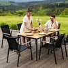 A couple is enjoying a meal at a table set up on a wooden deck with a scenic view of hills and trees in the background. Produktbild-Vorschau