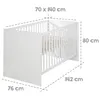 A white baby crib with dimensions indicated by dashed lines and text. Produktbild-Vorschau