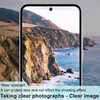A smartphone displaying a scenic view of cliffs and the ocean, with text overlays describing product features. Produktbild-Vorschau
