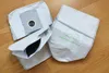 A set of vacuum cleaner bags on a wooden floor. Produktbild-Vorschau