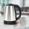 A stainless steel electric kettle with a black handle and base is placed on a countertop. Produktbild-Vorschau