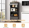 A kitchen storage unit with various items on its shelves, placed next to a window and a white cabinet. Produktbild-Vorschau