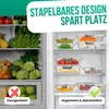 A refrigerator interior showing organized and unorganized food storage using glass containers. Produktbild-Vorschau