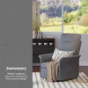 A grey recliner chair with a beige throw blanket and a patterned pillow, placed in a living room setting with a window view of a garden and a bookshelf. Podgląd zdjęcia produktu