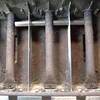 A close-up view of three metal gas burners inside a grill. Anteprima dell’immagine prodotto