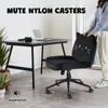 A black office chair with a cat face design is placed next to a desk, with a person standing behind it. A laptop and camera are on the desk. Voir les images du produit