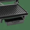 A close-up view of a black electric panini grill, focusing on the grilling surface and a drip tray. Produktbild-Vorschau