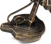 A close-up shot of the base and lower stem of a vintage-style outdoor wall lamp. Voir les images du produit
