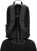 The back of a black backpack is shown attached to the handle of a rolling suitcase. Voir les images du produit