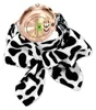 The back of a smartwatch with a cow-print scarf tied around it. Podgląd zdjęcia produktu