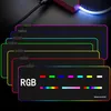 A stack of RGB gaming mousepads with different colored LED lighting. Produktbild-Vorschau