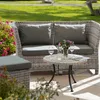 Outdoor lounge furniture set with a sofa, ottoman, and coffee table on a patio. Produktbild-Vorschau