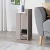 A modern nightstand is placed next to a sofa in a living room setting. Podgląd zdjęcia produktu