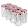 A group of glass jars with red and white checkered lids. Podgląd zdjęcia produktu
