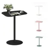 A black side table with a vase of flowers and a cup of coffee on it, shown alongside three other side tables in different colors (white, pink, and blue). Anteprima dell’immagine prodotto