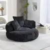 A dark gray beanbag chair with three pillows is shown in a room. Podgląd zdjęcia produktu