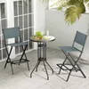 Two blue bar stools and a small round table are set up on an outdoor patio. Podgląd zdjęcia produktu
