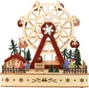 A wooden Ferris wheel decoration with figures and a small house, set against a white background. Náhled obrázku produktu