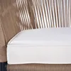 A close-up view of a beige rope chair with a white cushion. Produktbild-Vorschau