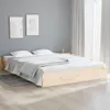 A bedroom scene with a wooden bed frame, white bedding, and two framed pictures on a gray wall. Produktbild-Vorschau