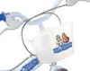 Close-up of a bicycle basket with cartoon characters and text. Voir les images du produit
