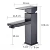 A black bathroom faucet with dimensions indicated by measurement lines and text. Podgląd zdjęcia produktu