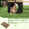 A cat exiting a modern cat house in a grassy outdoor setting. Voir les images du produit