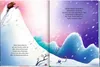 A winter scene with snow-covered hills and falling snow, with text on both pages. Voir les images du produit