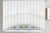 A white lace curtain is shown hanging over a window. Produktbild-Vorschau