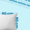 A white pillow is shown against a light blue background with text overlayed. Voir les images du produit