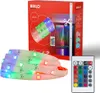 A product shot of an LED strip light kit, including the packaging, the LED strip itself, and a remote control. Produktbild-Vorschau
