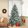 A decorated Christmas tree with presents underneath, a wreath on the wall, and stockings hanging by the fireplace. Náhled obrázku produktu