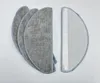 A set of replacement mop pads and a filter for a robot vacuum cleaner. Voir les images du produit