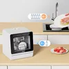 A compact dishwasher is shown on a kitchen counter next to a sink. There are graphic overlays indicating water usage. Produktbild-Vorschau