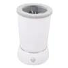 A white automatic pet paw cleaner with a gray rim and internal brushes, shown against a white background. Voir les images du produit